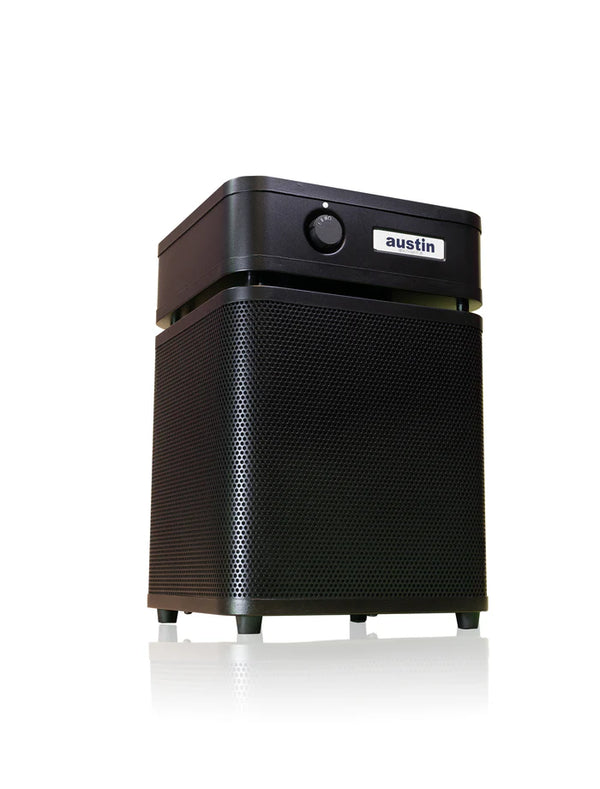 Austin Air HealthMate Junior compact air purifier with 360-degree intake and steel housing.
