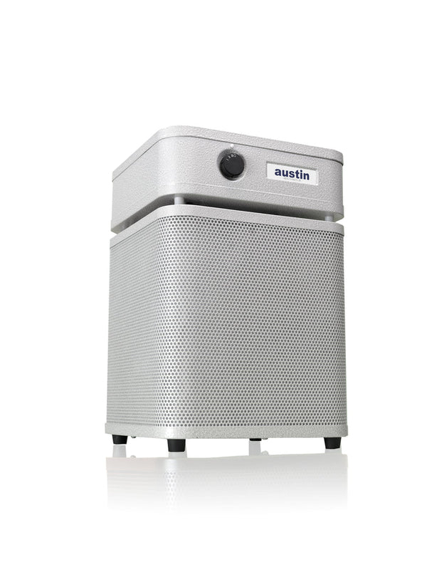 Austin Air HealthMate Junior compact air purifier with 360-degree intake and steel housing.