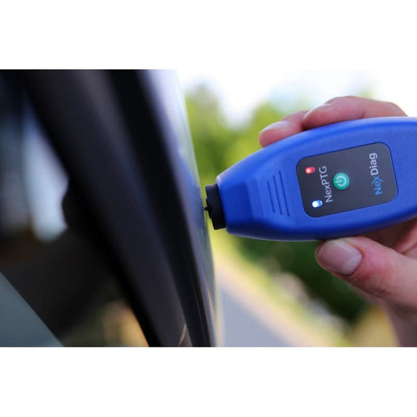 Using NexPTG coating thickness gauge on car panel for accurate paint thickness testing