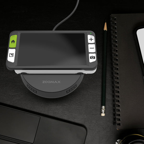 Zoomax Luna 6 video magnifier on desk with notebook and pencil for everyday reading tasks