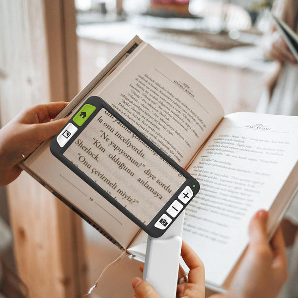 Zoomax Luna 6 helping users read small text in books with magnification for low vision support