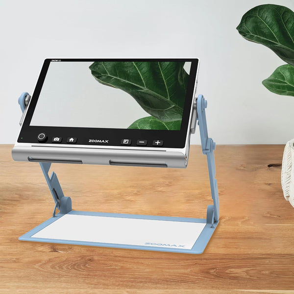 Zoomax Snow 12 video magnifier placed on desk for reading and daily low vision assistance