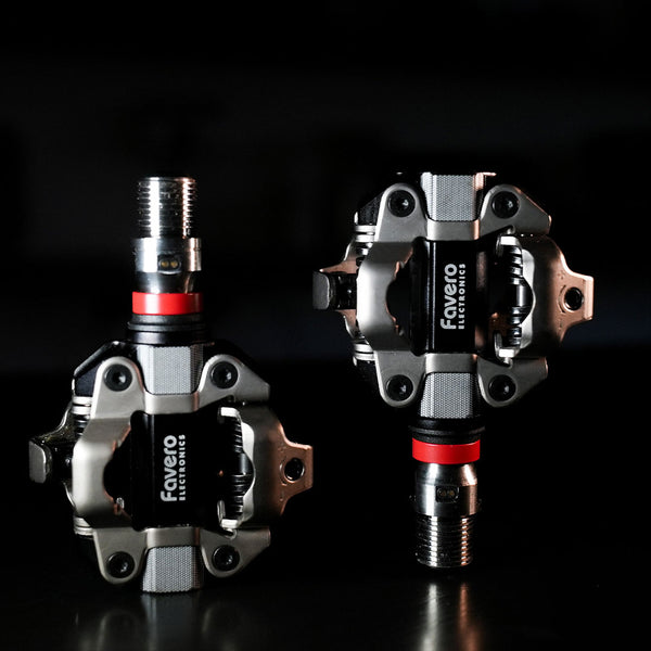 Favero Assioma PRO MX‑UP kit including right power pedal sensor, magnetic charging connectors, and washers
