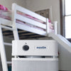 Austin Air HealthMate Junior compact air purifier with 360-degree intake and steel housing.