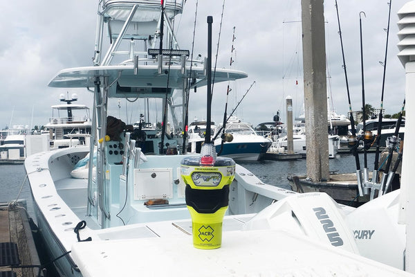 ACR GlobalFix V6 EPIRB placed on boat dock in marina environment for marine safety equipment setup