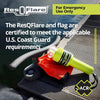ACR ResQFlare electronic distress flare placed on dock with flag, US Coast Guard compliant marine safety device