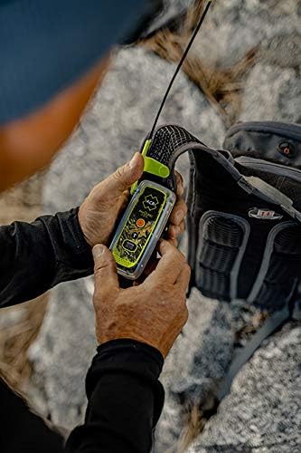 User holding ACR ResQLink 400 personal locator beacon outdoors for emergency signaling and GPS tracking