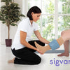 Caregiver assisting patient with compression stockings using Doff N’ Donner sleeve