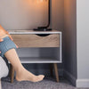 Person independently putting on compression stockings using Doff N’ Donner sleeve