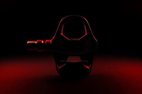 Favero Assioma PRO RL-1 power meter pedal with dramatic lighting showing front profile