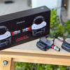 Favero Assioma Pro RL pedals with original packaging displayed in real-world outdoor setup