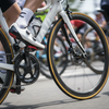 Cyclist riding road bike using Favero Assioma power meter pedals during road cycling race