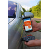 Using NexPTG paint thickness gauge on car surface with smartphone app showing coating data