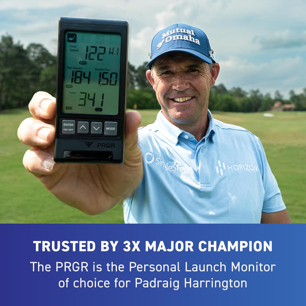 Professional golfer holding PRGR portable launch monitor on golf course for swing tracking and distance analysis