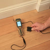 Protimeter SurveyMaster moisture meter using external probe attachment on wooden floor surface