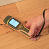 Protimeter SurveyMaster moisture meter measuring moisture content on hardwood flooring