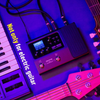 Valeton GP-100 multi effects processor setup with electric guitar keyboard and cables for music production