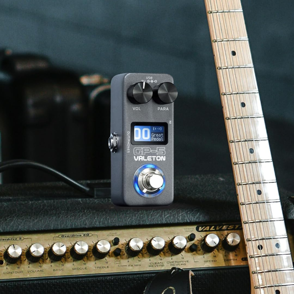 Valeton GP-5 compact multi effects pedal placed on guitar amplifier with electric guitar setup
