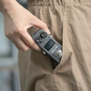 Valeton GP-5 compact multi effects pedal being placed in pocket highlighting portable design