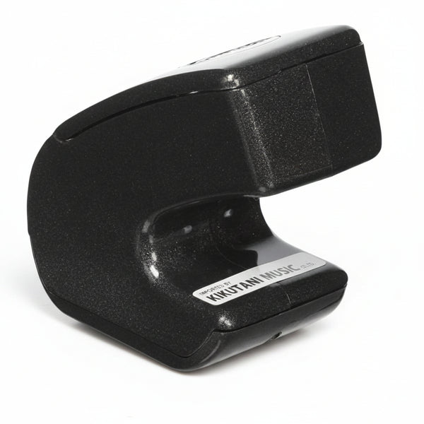 Ebow Plus guitar sustainer side profile showing compact handheld electronic bow design